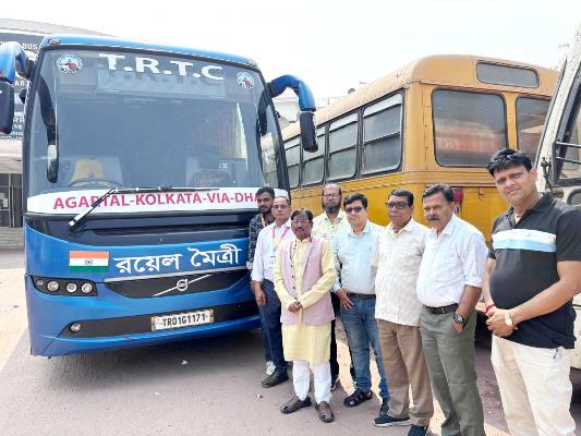 Tripura Road Transport Corporation (TRTC) Vice-Chairman Samar Roy  along with TRTC employees standing in front of a Agartala-Dhaka-Kolkata bus on Saturday before a trail run up to Dhaka. He said the schedule for regular bus service operations with neighbouring country would be announced on February 28 after assessing the outcome of a few trial runs.