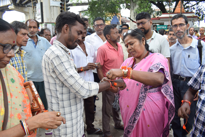 Former Central Minister Pratima Bhoumik celebrates Raksha Bandhan festival in Battala market area of Agartala on August 28.