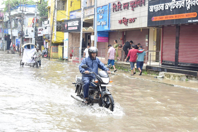 Heavy downpour for hours creates widespread waterlogging across the state capital city Agartala on July 10 morning, disrupting normal life and exposing the poor drainage infrastructure.  