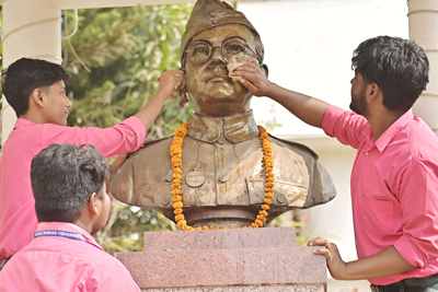 A statue of Netaji Subhash Chandra Bose being cleaned by students of Netaji Subash Vidyaniketan in Agartala on January 21 ahead of his birthday anniversary.