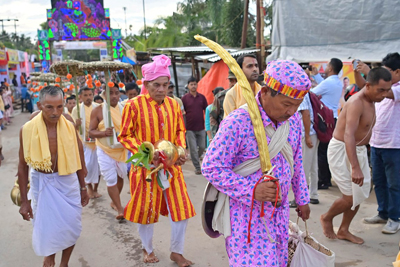 Priests carrying idols of Gods and Goddess during the beginning of weeklong Kharchi Puja and festival at Chaturdash Devta Temple, at the outskirts of Agartala on July 22.