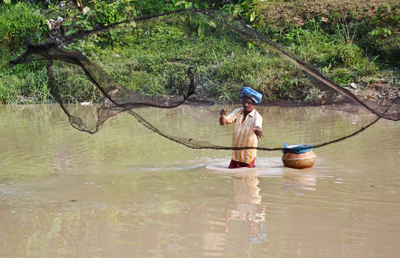 People start fishing with their nets as water levels rise in river Howrah of Agartala on May 18.