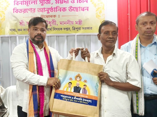 Food and civil supplies Minister Sushanta Chowdhury distributes sugar, flour among beneficiaries at a fair price shop near Pragati School road in Agartala on October 24.