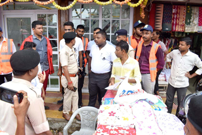 Task Force of Agartala Municipal Corporation (AMC) conducts enforcement drive in the City on June 26 to clear encroachment of footpaths.