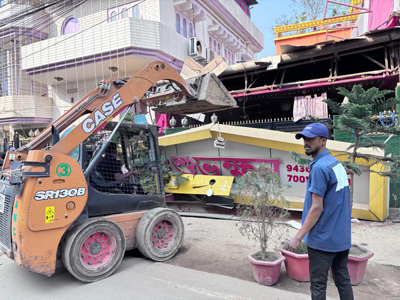 Agartala Municipal Corporation (AMC) Task Force conducts an eviction drive in presence of Mayor Dipak Majumder at Ker Chowmuhani area of the city on January 17.