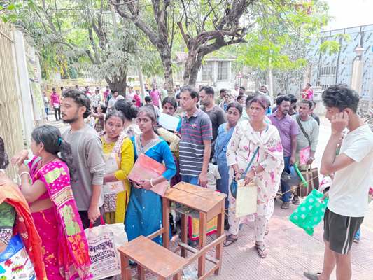 Parents standing in long queues in front of  Sishu Bihar school in Agartala on March 12 to collect admission forms for Nursery.