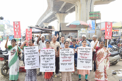 SUCI organised a protest against gas price hike at Battala area of Agartala on March 11.