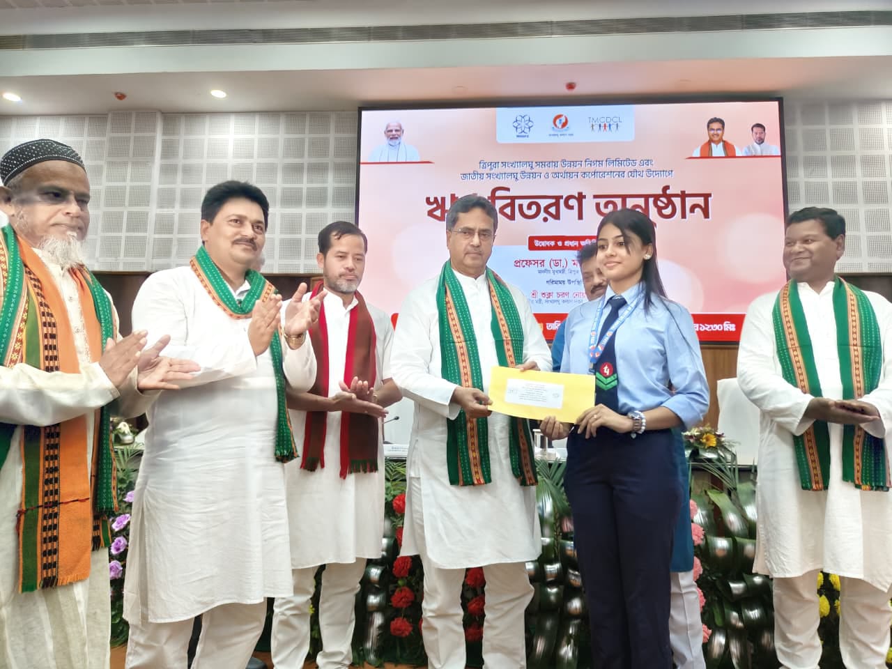 Chief Minister Dr Manik Saha distributes different loan amounts to beneficiaries  of minority communities during a programme held at Pragna Bhavan in Agartala on July 29.