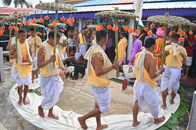 Priests carrying idols of Gods and Goddess during the beginning of weeklong Kharchi Puja and festival at Chaturdash Devta Temple, at the outskirts of Agartala on July 22.