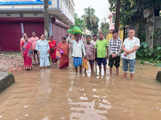 Residents of Ward No. 6 in Kashipur are of Agartala stage a protest demanding immediate restoration of their locality road on May 27.