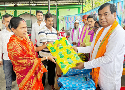Mayor of Agartala Municipal Corporation (AMC) Dipak Majumder distributes clothes among the poor under the initiative of Rajnagar mosque on September 8.
