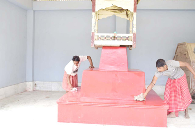 Devotees prepare Rangoli on the occasion of Dul Purnima festival at Agartala on March 2.