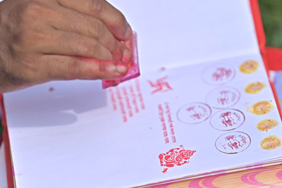 Priests are giving religious symbols to new account books at the Lakshmi Narayan temple for the good of the business at Agartala on April 15, during the celebration of Bengali New Year.
