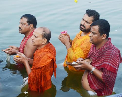 Religious Hindus offer Tarpan on the auspicious day of Mahalaya on October 10 morning in Agartala by offering water to deceased ancestors souls is called Pitru Tarpan. By performing Tarpan the deceased ancestors souls not only get satisfied and leave human surroundings, but they also bestow long life, radiance, superior intellect, wealth, success and foodstuff on the host performing the Tarpan and satisfies him too.