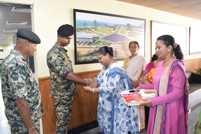 Mahila Congress leaders tie Rakhis to BSF personnel posted at Akhaura check post in Agartala on August 27.