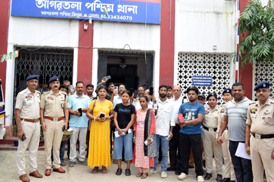 Police officials return lost mobile phones among rightful owners at West Agartala police station on August 24.