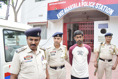 A murder accused being taken to court for production in Agartala on March 31.