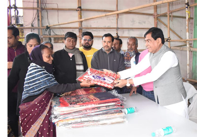 Mayor of Agartala Municipal Corporation (AMC) Dipak Majumder distributes winter clothes among local people under AMC ward number-15 on January 6.