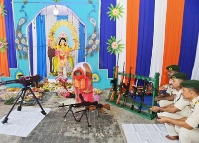 A priest worships arms and ammunition on the occasion of Vishwakarma Puja at the headquarters of 2nd battalion TSR, at the outskirts of Agartala on September 18.