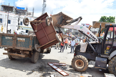 Agartala Municipal Corporation (AMC) task force conducts an enforcement drive at the Post Office Chowmuhani area of the city  on August 8 against encroachment.
